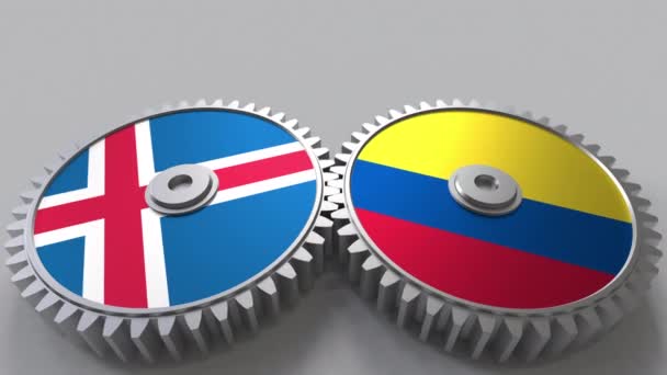 Banderas de Islandia y Colombia en engranajes de malla. Cooperación internacional animación conceptual — Vídeo de stock