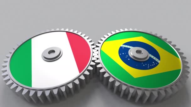 意大利和巴西在啮合齿轮上的旗帜。国际合作概念动画 — 图库视频影像