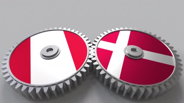 Flaggor i Peru och Danmark på Meshning gears. Internationellt samarbete konceptuella animation — Stockvideo