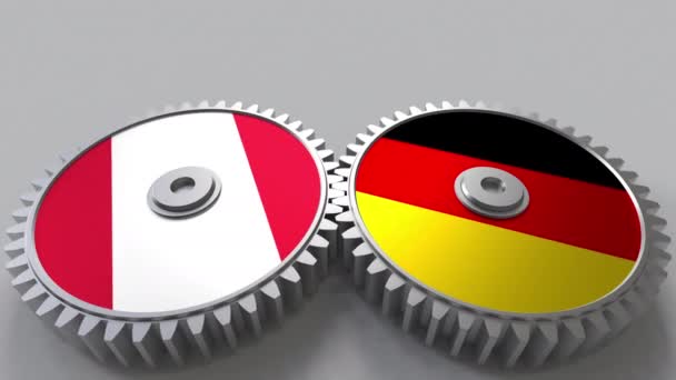 Flaggen von Peru und Deutschland auf Maschenrädern. Konzeptionelle Animation der internationalen Zusammenarbeit — Stockvideo