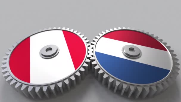 Flags of Peru and Netherlands on meshing gears. International cooperation conceptual animation — Stock Video