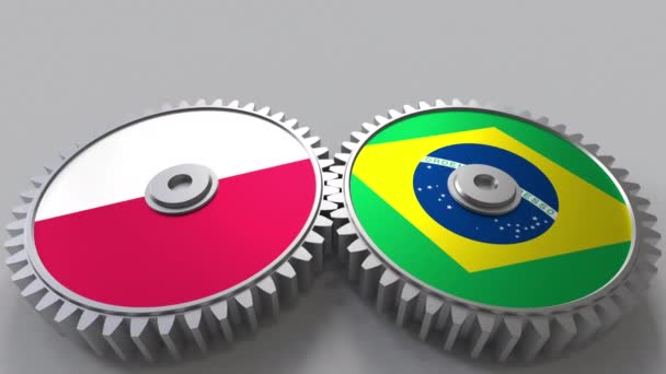 Flags of Poland and Brazil on meshing gears. International cooperation conceptual animation — Stock Video