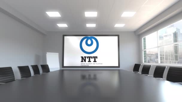 Nippon Telegraph en telefoon Corporation Ntt logo op het scherm in een vergaderruimte. Redactionele 3d animatie — Stockvideo