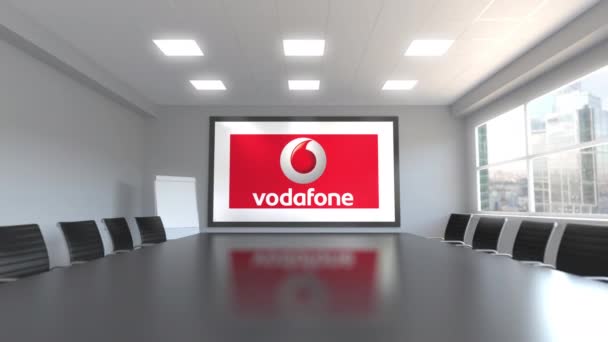 Vodafone-logo op het scherm in een vergaderruimte. Redactionele 3d animatie — Stockvideo