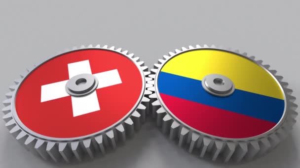 Banderas de Suiza y Colombia en engranajes de malla. Cooperación internacional animación conceptual — Vídeo de stock