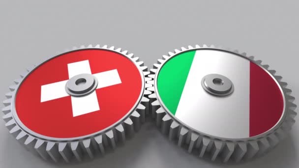 Flags of Switzerland and Italy on meshing gears. International cooperation conceptual animation — Stock Video