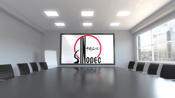 Sinopec logo op het scherm in een vergaderruimte. Redactionele 3d animatie — Stockvideo