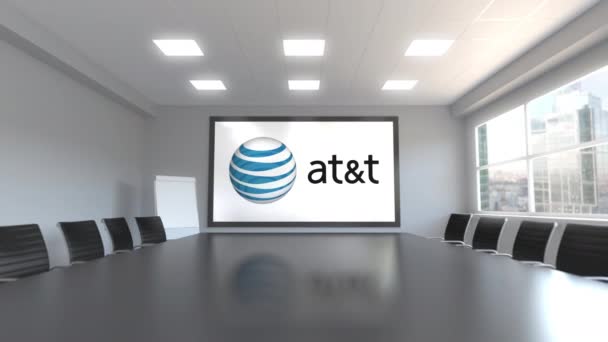 Логотип American Telephone and Telegraph Company AT T на экране в конференц-зале. Редакционная 3D анимация — стоковое видео