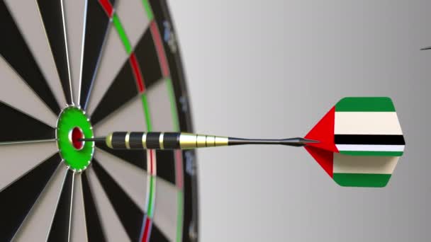 Flags of China and the UAE on darts hitting bullseye of the target. International cooperation or competition conceptual animation — Stock Video