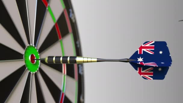 Flags of China and Australia on darts hitting bullseye of the target. International cooperation or competition conceptual animation — Stock Video