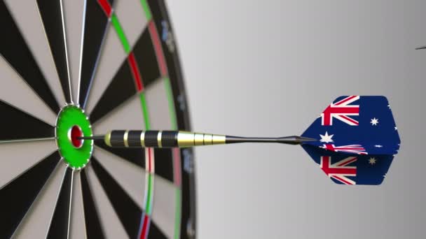 Flags of Canada and Australia on darts hitting bullseye of the target. International cooperation or competition conceptual animation — Stock Video