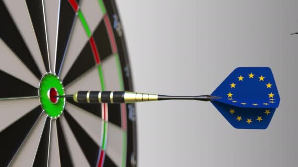 Flags of the United Kingdom and the European Union on darts hitting bullseye of the target. International cooperation or competition conceptual animation — Stock Video