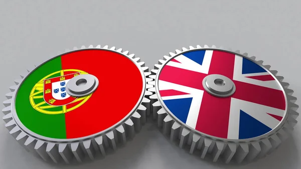 Flags of Portugal and The United Kingdom on meshing gears. International cooperation conceptual 3D rendering — Stock Photo, Image