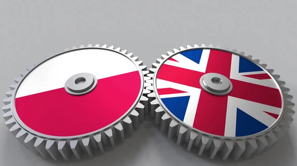 Flaggor av Polen och Förenade kungariket på Meshning gears. Internationellt samarbete konceptuell 3d-rendering — Stockfoto