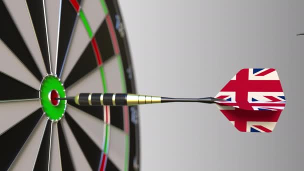 Flags of Spain and the United Kingdom on darts hitting bullseye of the target. International cooperation or competition conceptual animation — Stock Video