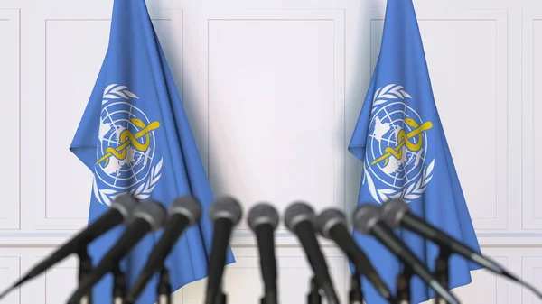 Verdens helseorganisasjon WHOs offisielle pressekonferanse. Flagg og mikrofoner. Begrepsredaksjonell 3D-gjengivelse – stockfoto