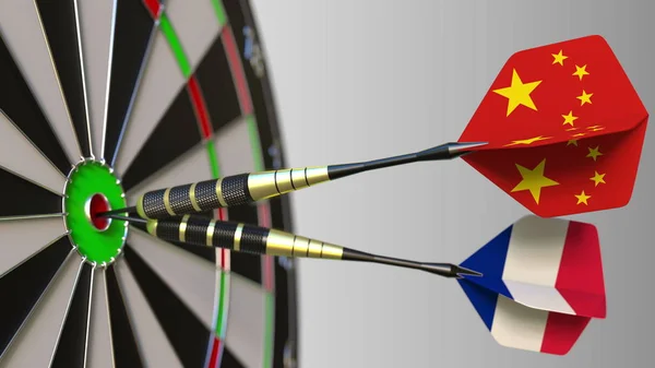 Kína és Franciaország a darts ütő telitalálat a cél. Nemzetközi együttműködés, illetve a verseny fogalmi 3d-leképezés — Stock Fotó