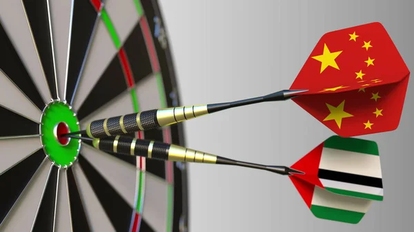 Kína és az Egyesült Arab Emírségekben a darts ütő telitalálat a cél. Nemzetközi együttműködés, illetve a verseny fogalmi 3d-leképezés — Stock Fotó