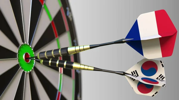 Franciaország és Korea a darts ütő telitalálat a cél. Nemzetközi együttműködés, illetve a verseny fogalmi 3d-leképezés — Stock Fotó