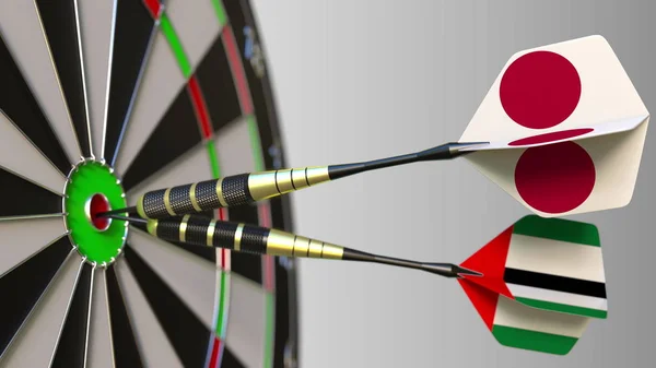 Japán és az Egyesült Arab Emírségekben a darts ütő telitalálat a cél. Nemzetközi együttműködés, illetve a verseny fogalmi 3d-leképezés — Stock Fotó