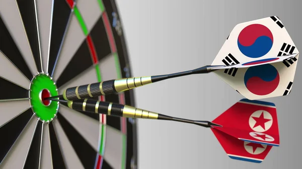 Güney Kore ve Kuzey Kore bayrakları Dart hedef bullseye isabet üzerinde. Uluslararası işbirliği ya da rekabet kavramsal 3d render — Stok fotoğraf