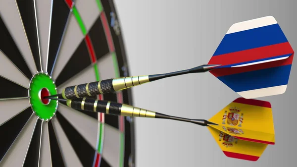 Zászlók, Oroszország és Spanyolország a darts ütő telitalálat a cél. Nemzetközi együttműködés, illetve a verseny fogalmi 3d-leképezés — Stock Fotó