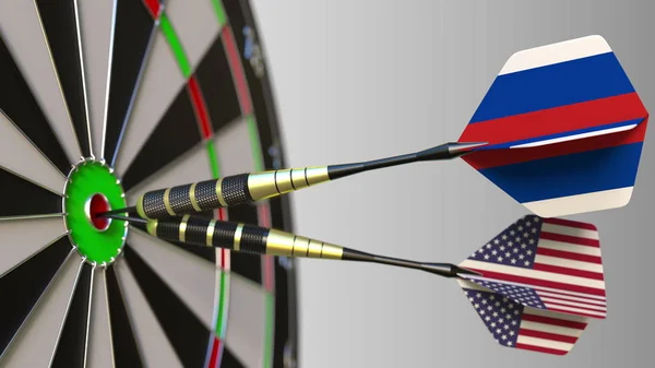 Flags of Russia and the USA on darts hitting bullseye of the target. International cooperation or competition conceptual 3D rendering — Stock Photo, Image