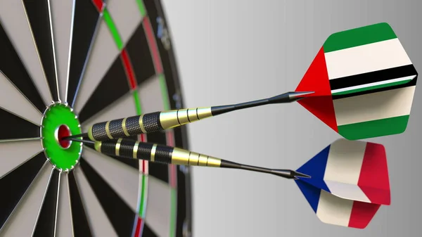 Birleşik Arap Emirlikleri ve Fransa üzerinde bayrakları hedef isabet bullseye Dart. Uluslararası işbirliği ya da rekabet kavramsal 3d render — Stok fotoğraf