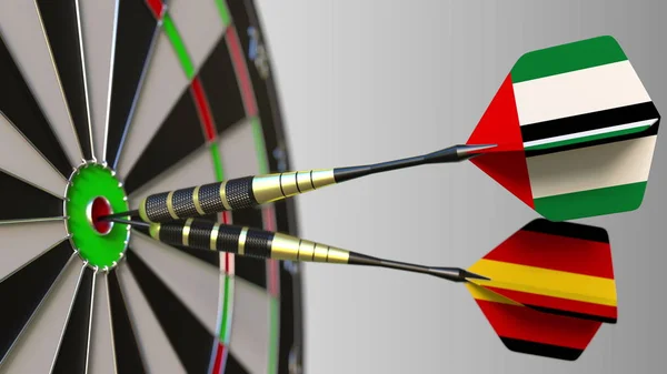 Az Egyesült Arab Emírségek és Németország a darts ütő telitalálat a cél. Nemzetközi együttműködés, illetve a verseny fogalmi 3d-leképezés — Stock Fotó