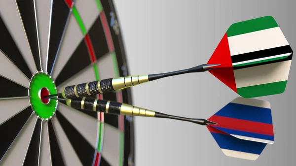 Birleşik Arap Emirlikleri ve Rusya bayraklarını hedef isabet bullseye Dart. Uluslararası işbirliği ya da rekabet kavramsal 3d render — Stok fotoğraf