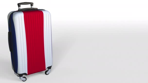 Travelers suitcase featuring flag of Costa Rica. Tourism conceptual animation, blank space for caption — Stock Video