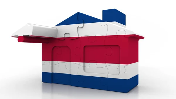 Puzzle budynku domu featuring flaga Kostaryki. Costa Rican emigracji, budowy lub nieruchomości na rynku pojęciowy renderowania 3d — Zdjęcie stockowe