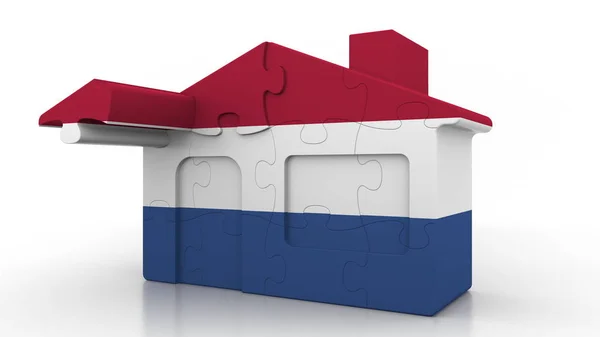 Bâtiment maison puzzle avec drapeau des Pays-Bas. Néerlandais émigration, construction ou immobilier marché conceptuel 3D rendu — Photo