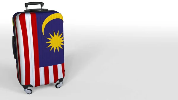 Travelers suitcase featuring flag of Malaysia. Malaysian tourism conceptual 3D renering, blank space for caption — Stock Photo, Image