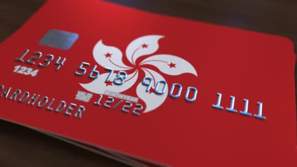 Tarjeta bancaria de plástico con bandera de Hong Kong. Sistema bancario animación conceptual — Vídeos de Stock