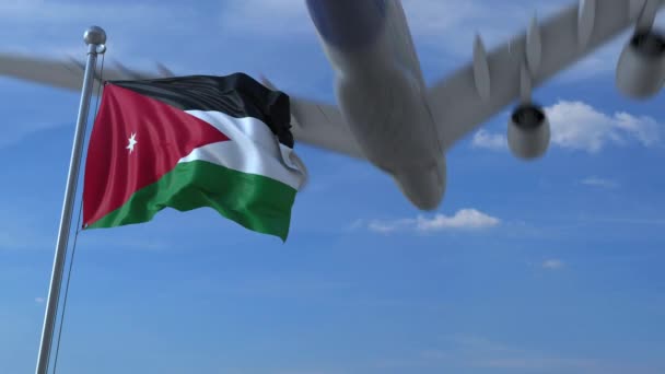 Commercial airplane flying above waving flag of Jordan. Jordanian emigration or tourism related animation — Stock Video