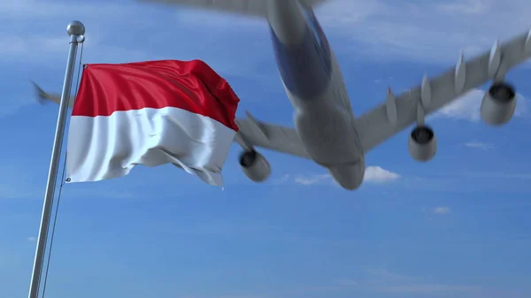 Commerciële vliegtuig vliegen boven zwaaien vlag van Indonesië. 3D-rendering — Stockfoto