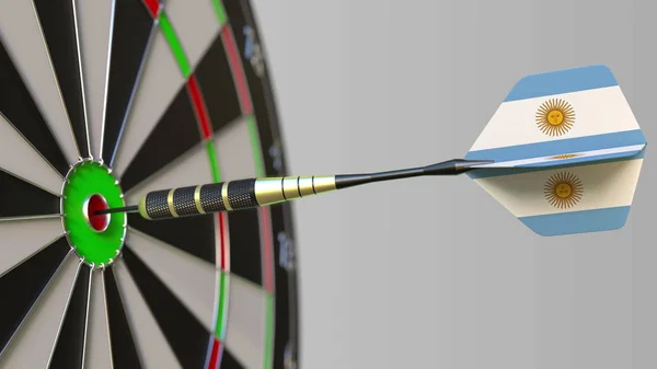 Dart featuring flag of Argentina hits bullseye of the target. Sports or political success related conceptual 3D rendering — Stock Photo, Image