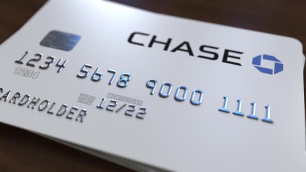 Plastkort med logotypen för Chase Bank. Redaktionella konceptuell 3d-animering — Stockvideo