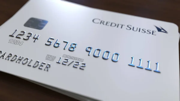 Plastic bank card with logo of Credit Suisse. Editorial conceptual 3D rendering — Stock Photo, Image