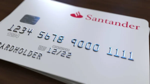 Plastic card with logo of Santander Bank. Editorial conceptual 3D rendering — Stock Photo, Image