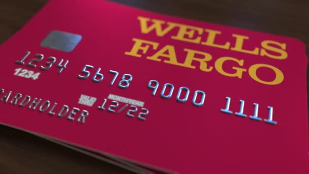 Plastic bank card with logo of Wells Fargo. Editorial conceptual 3D animation — Stock Video