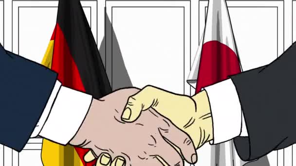 Бизнесмены или политики пожимают руку флагу Германии и Японии. Встреча или сотрудничество в области мультипликации — стоковое видео