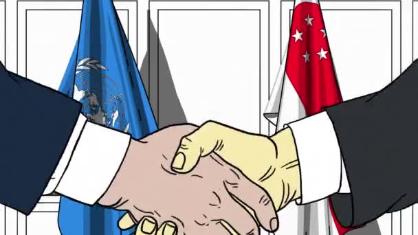 Forretningsmænd eller politikere giver hånd mod De Forenede Nationers og Singapores flag. Officielt møde eller samarbejdsrelateret redaktionel animation – Stock-video