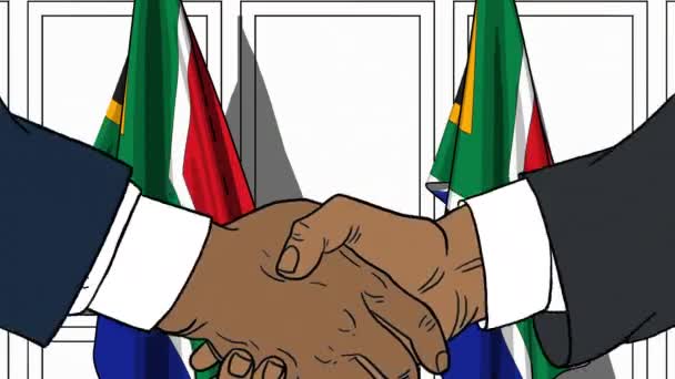 Businessmen or politicians shake hands against flags of South Africa. Official meeting or cooperation related cartoon animation — Stock Video