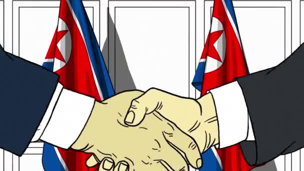 İş adamları veya politikacılar Kuzey Kore bayrakları karşı el sıkışın. Resmi toplantı veya işbirliği çizgi film animasyon ile ilgili — Stok video