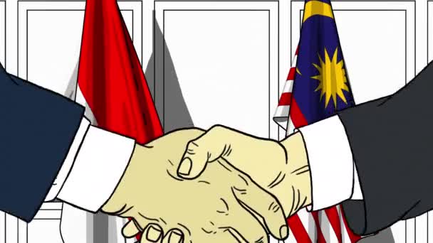 Geschäftsleute oder Politiker schütteln Hände gegen Flaggen Indonesiens und Malaysias. offizielles Treffen oder Zusammenarbeit im Zusammenhang mit Zeichentrickfilmen — Stockvideo
