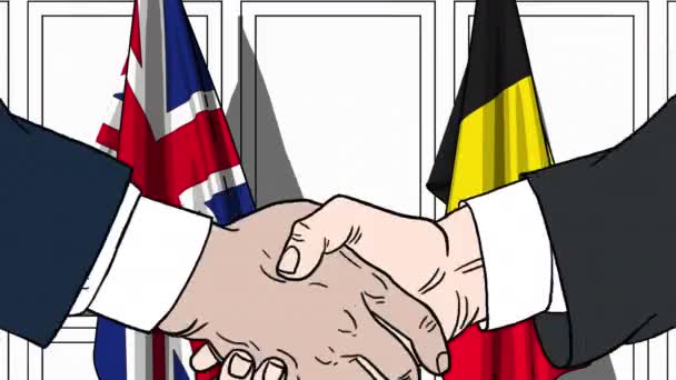 Επιχειρηματίες ή πολιτικοί χειραψία κατά σημαίες της Βρετανίας και του Βελγίου. Επίσημη συνάντηση ή συνεργασίας που σχετίζονται με κινούμενα σχέδια — Αρχείο Βίντεο