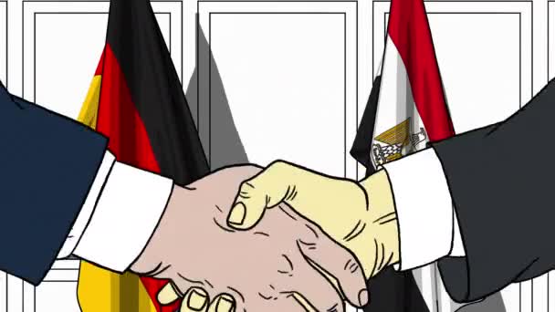 Businessmen or politicians shake hands against flags of Germany and Egypt. Official meeting or cooperation related cartoon animation — Stock Video