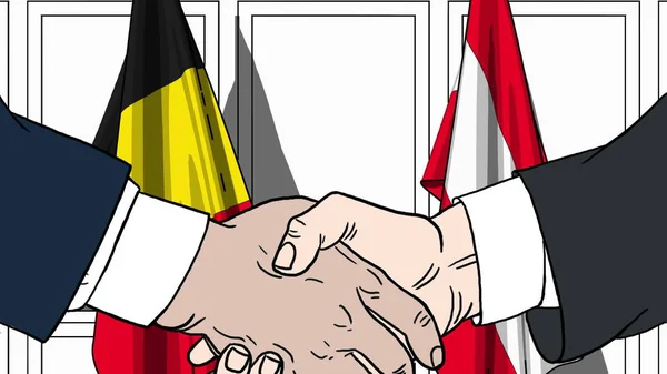 Uomini d'affari o politici stringono la mano contro le bandiere del Belgio e dell'Austria. Riunione ufficiale o illustrazione dei cartoni animati relativi alla cooperazione — Foto Stock